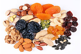 Groups of various kinds of dried fruits on white background